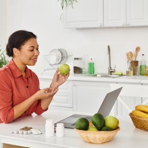 happy-african-american-nutritionist-holding-apple-2024-03-27-21-45-21-utc-scaled.jpg